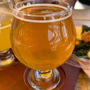 two glasses of beer on a table