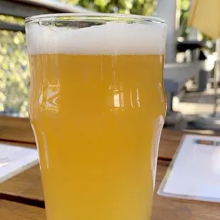 a glass of beer on a table