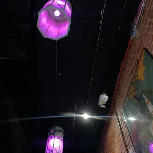 purple lights hanging from the ceiling
