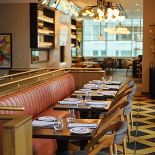 a restaurant with a long table and chairs