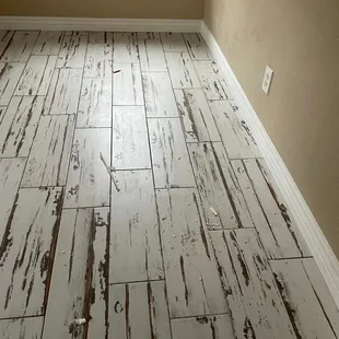 a white painted wood floor in a room