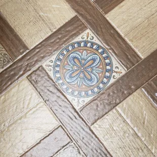 a decorative tile on the floor