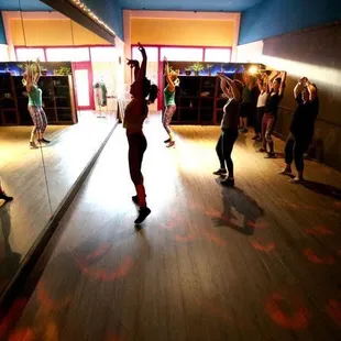 The Floor Polish studio has awesome light, full giant mirrors, a brand new floating wood dance floor, and a zillion fun ways to move.