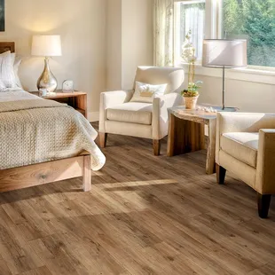 a bedroom with hardwood floors