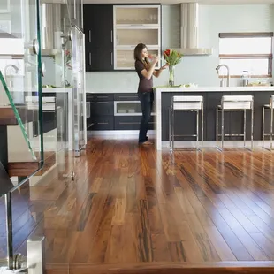 a woman standing in a modern kitchen