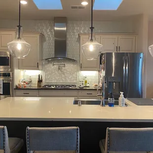 New replaced tile backsplash all the way over the cabinetry.