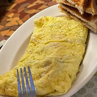 an omelet and toast on a plate
