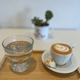 a glass of water and a cup of coffee