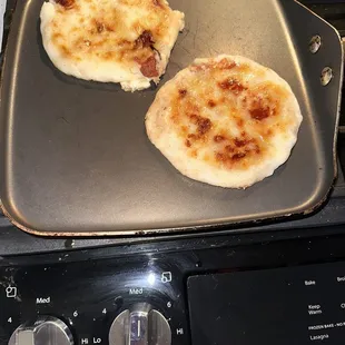 two pizzas on a pan
