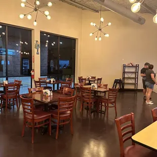 a restaurant with tables and chairs