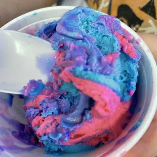 a person holding a bowl of ice cream