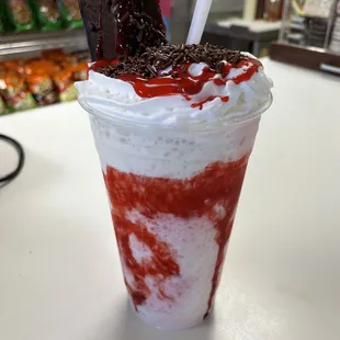 a milkshake with chocolate and strawberries