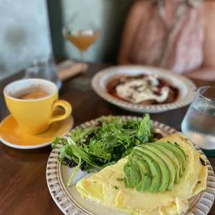 PRIMO OMELETTE (with added avocado) and HUEVOS ROTOS + vanilla latte.