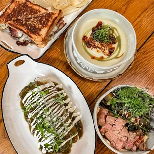 Breakfast pork belly burrito chili verde, pastrami sandwich, roasted veggie half bowl, potato leek soup.