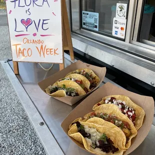 three tacos on a table