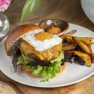 a burger with an egg on top