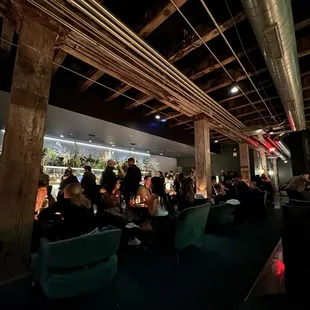 a large group of people sitting at tables