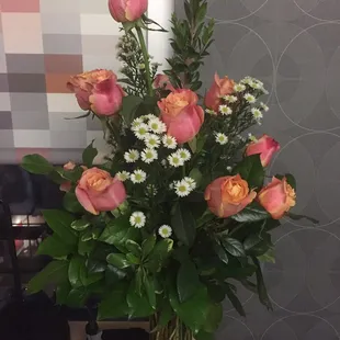 A dozen roses, vase included $65 + tax.