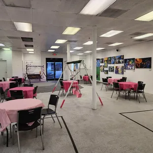 a large room with tables and chairs