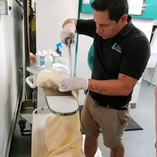 Abraham Reyes working on grease stains...