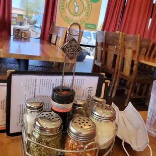 a table with spices and condiments
