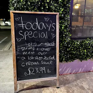 a chalkboard sign for a restaurant