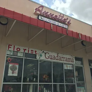 Outside the shop.