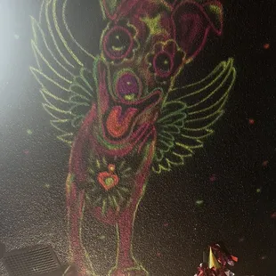 Dante from the movie Coco painted on the ceiling.