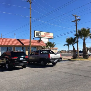 two trucks parked in front of the restaurant