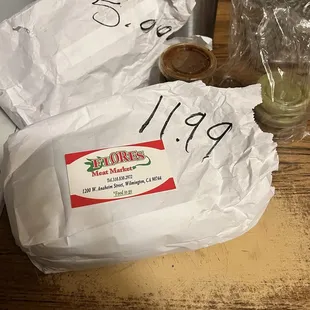 They put the price on your bag and you pay at the front counter .