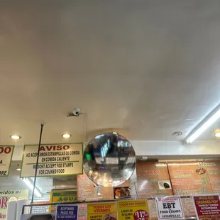 a mirror hanging from the ceiling