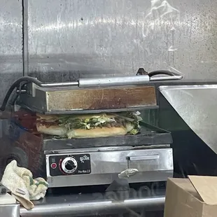 a pizza being cooked in a commercial oven