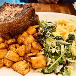 a plate of food with bread and vegetables