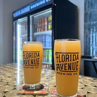 two glasses of beer on a table
