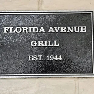 A marker honoring the establishment of the grill...
