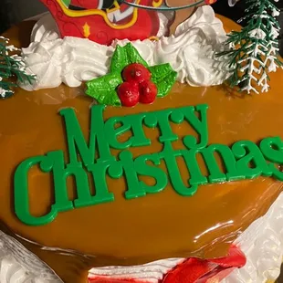 a christmas cake decorated with santa and sleigh