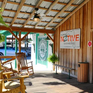 a porch with rocking chairs