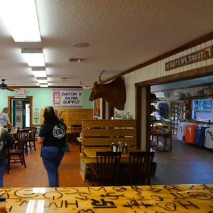 two women walking through a restaurant