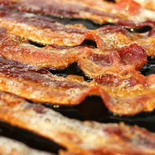 bacon cooking on a grill