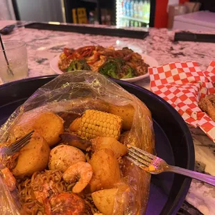a plate of shrimp and corn
