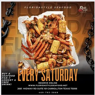 a plate of crab legs and corn on the cob