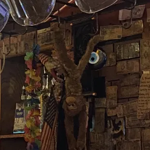 THE BARTENDER DIDNT EVEN TAKE MY TIP OR ASK IF WE WERE OK. THEN I NOTICE A BLACK MONKEY HANGING FROM AN AMERICAN FLAG