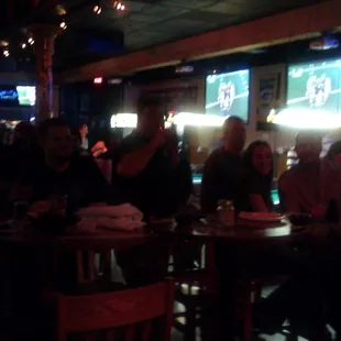 a crowd of people sitting at tables