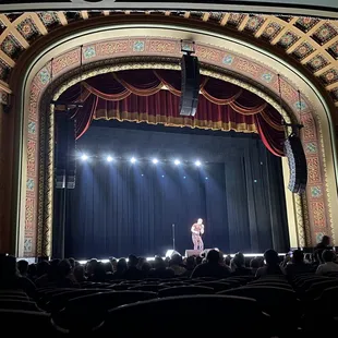 a woman on stage performing