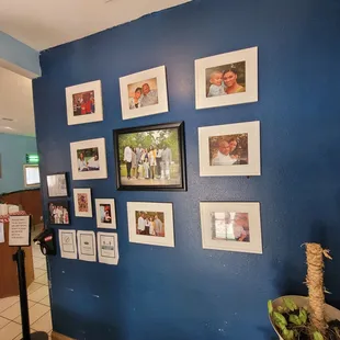 a wall of family photos