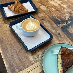 Croissant, latte and vegetable quiche