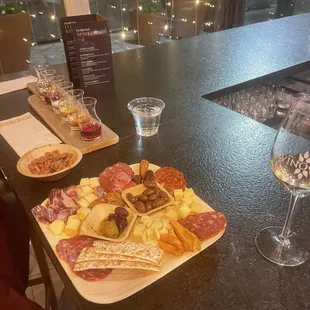 Wine flight, mixed nuts, charcuterie board.