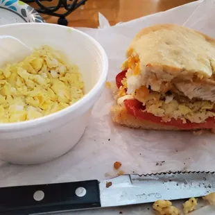 Scrambled eggs and the remaining half of my Cheese Chicken Biscuit (with added tomato).