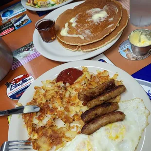Everything Omellete and the Pancake Breakfast with sausage links, hash browns and over easy eggs.