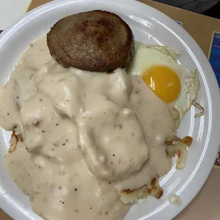 Sausage patty, eggs biscuits and gravy